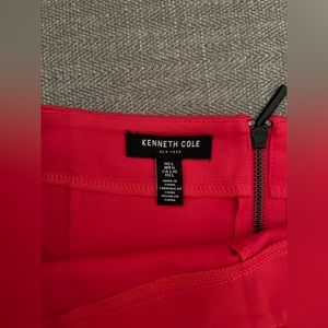 This is a new without tags Kenneth Cole, raspberry colored mini skirt size L